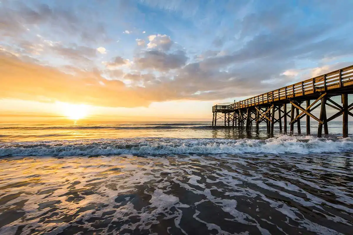 Fishing pier and the Atlantic Ocean at sunrise in Ventnor City.